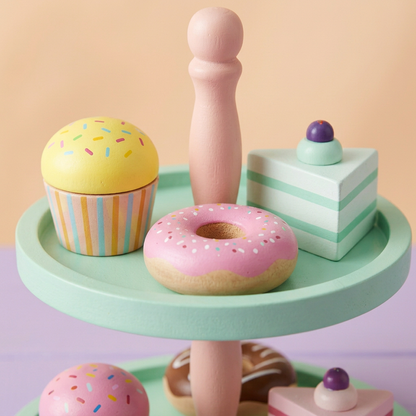Upper tier toy cupcake, doughnut and layered cake details