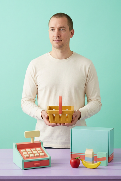 Adult male model holding toy shopping basket