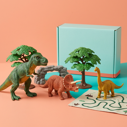 Dinosaur adventure play set with three figures, trees, rock arch, trail map and blank box